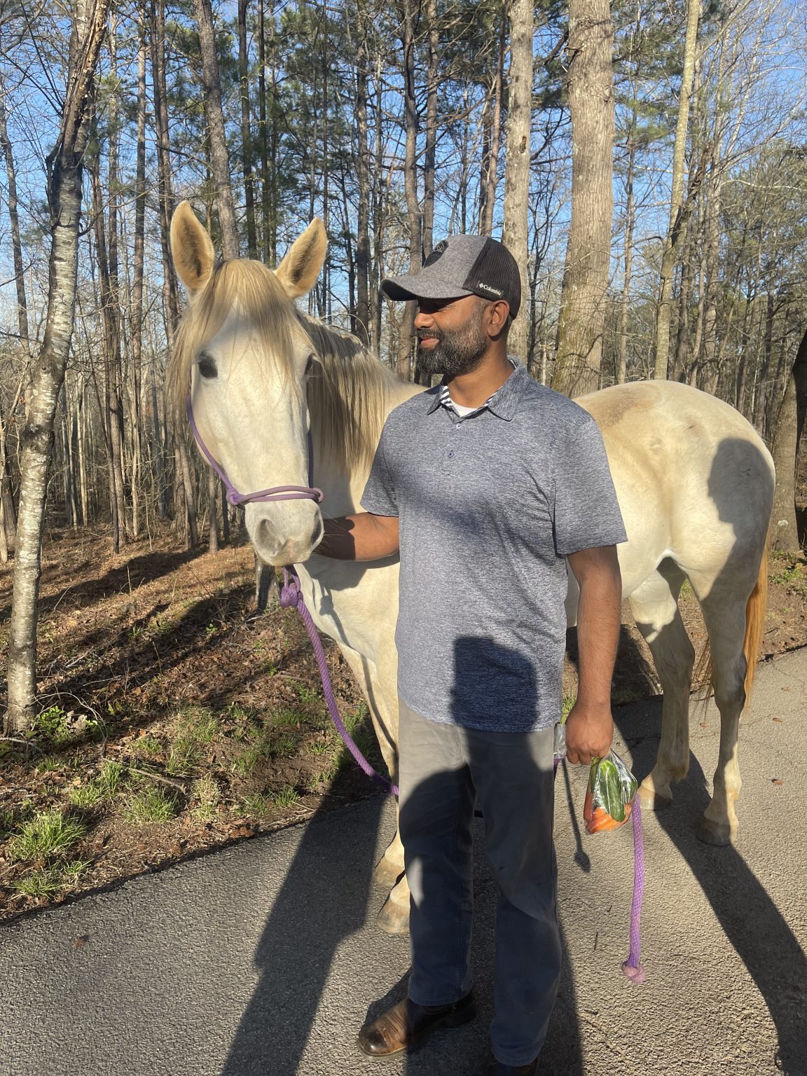 Owner Raki Joarder with a horse